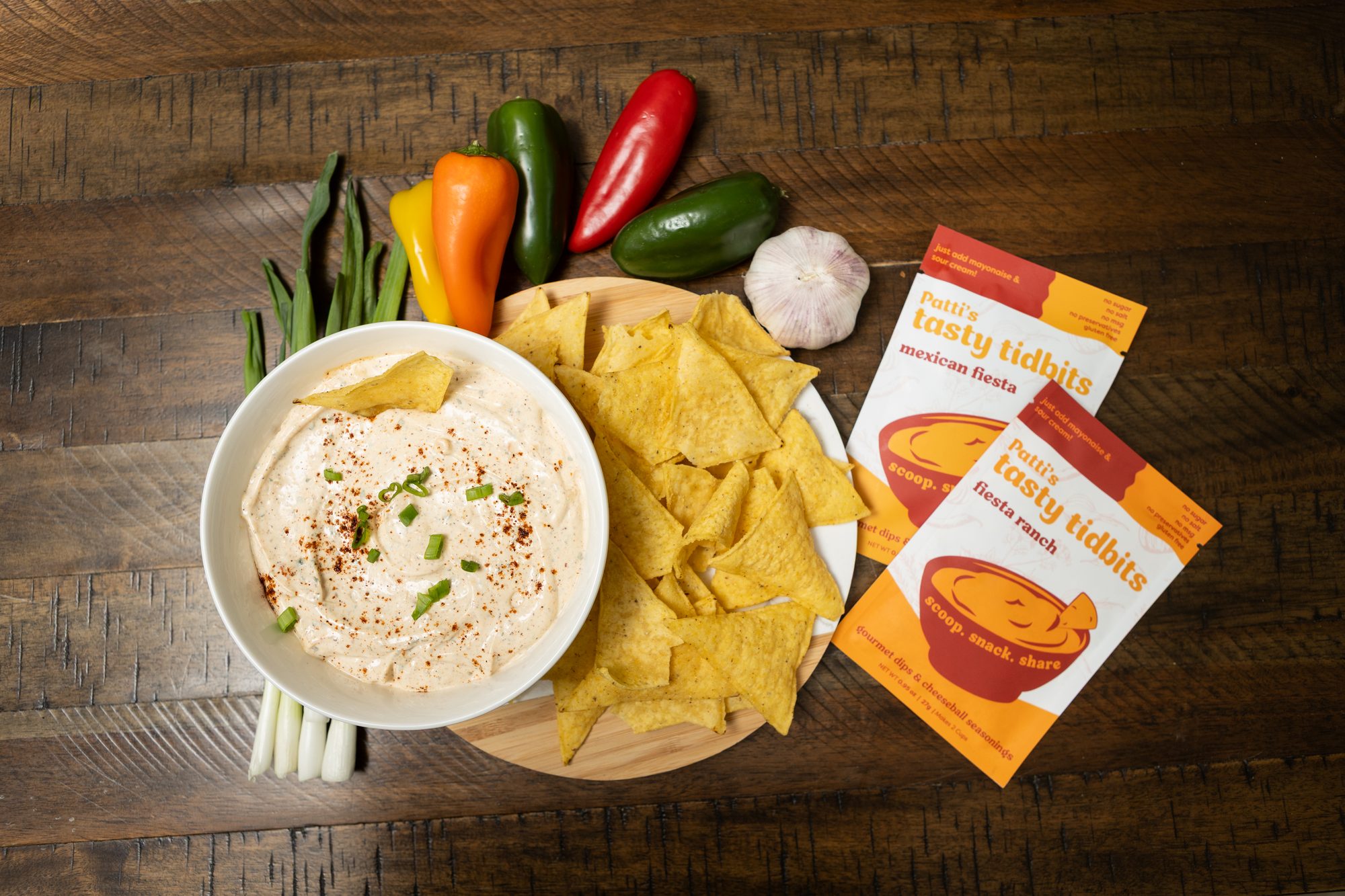 Garlic dip with tortilla chips and Patti's Tasty Tidbits pouches